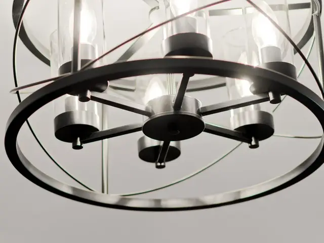 Round metal-framed chandelier with candle-style lights over the dining area.